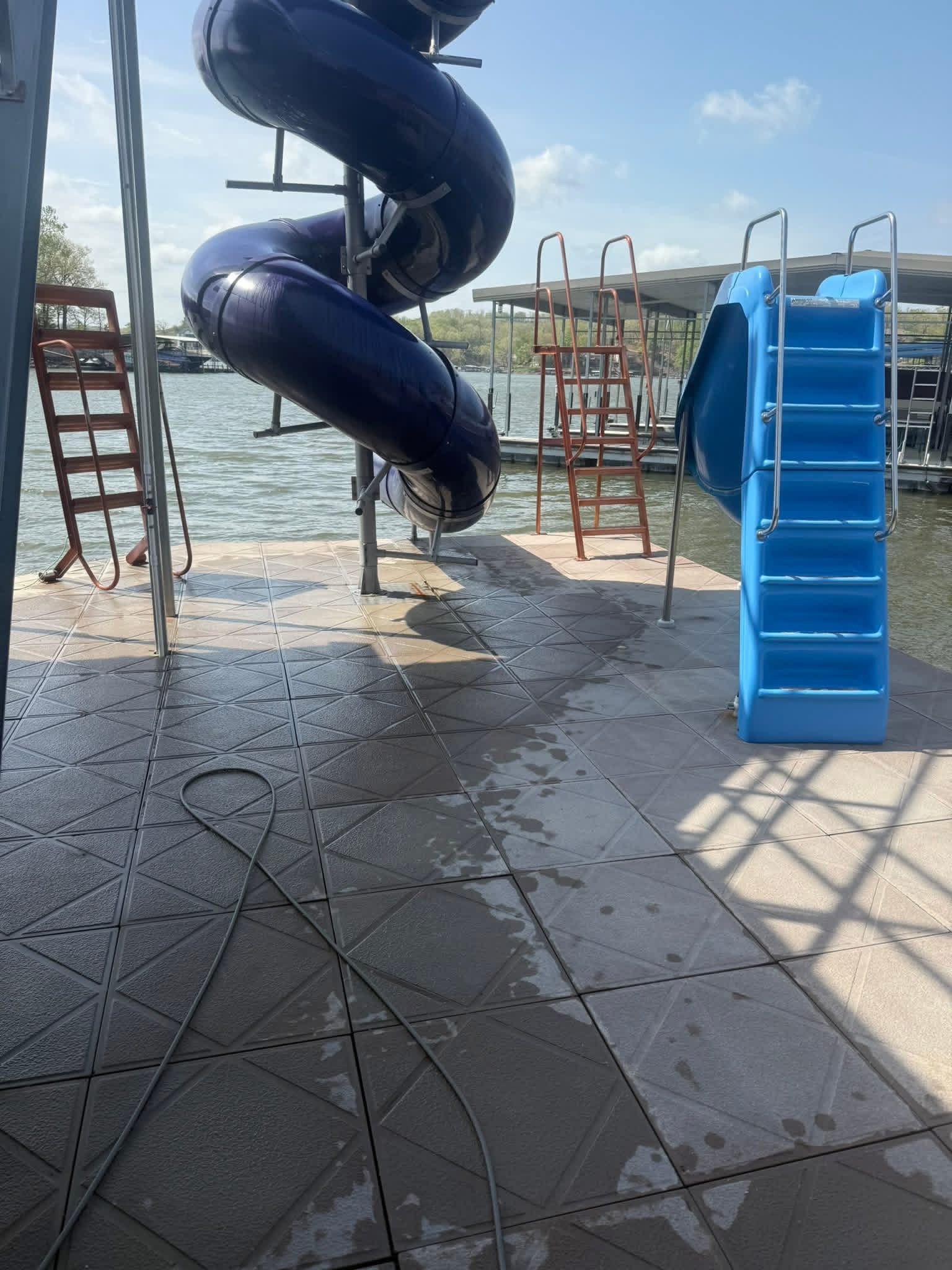 Dock cleaning project with slides at the Lake of the Ozarks